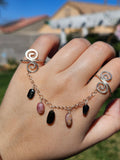 Adjustable connected tourmaline rings