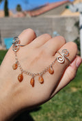 Adjustable connected sunstone rings