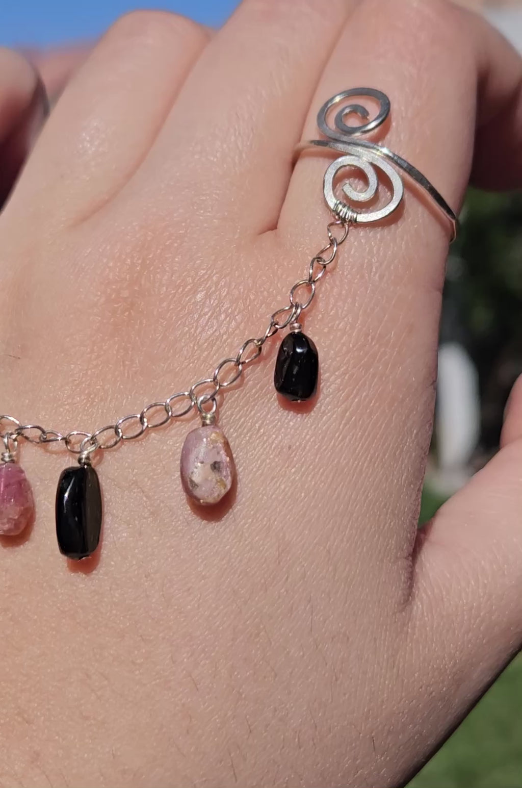 Adjustable connected tourmaline rings